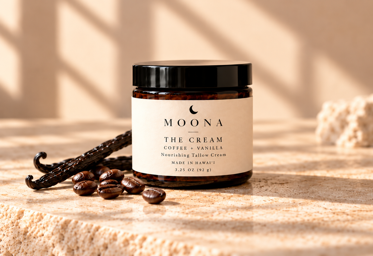 MOONA Coffee + Vanilla Nourishing Tallow Cream jar in a closer sunlit product photograph with coffee beans and vanilla pods.