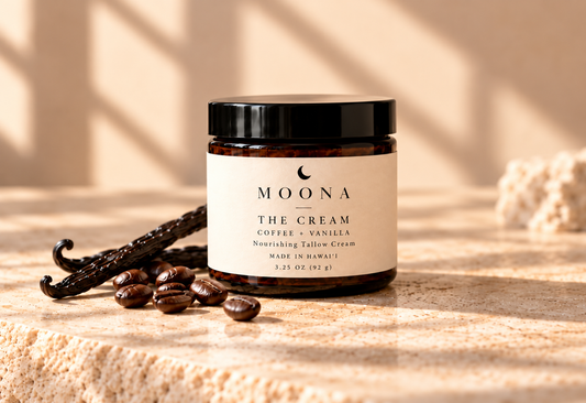 MOONA Coffee + Vanilla Nourishing Tallow Cream jar in a closer sunlit product photograph with coffee beans and vanilla pods.