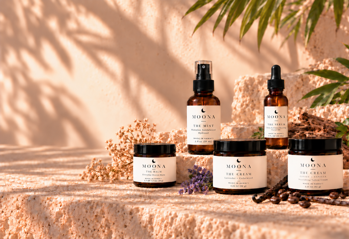 MOONA homepage lineup with a smaller Balm labeled 1.7 oz (48 g) without NET WT, Serum labeled 1 fl oz (30 mL), and two larger creams.